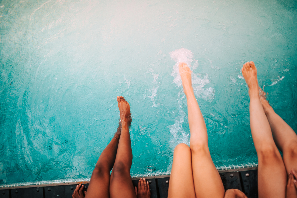 legs splash water in pool