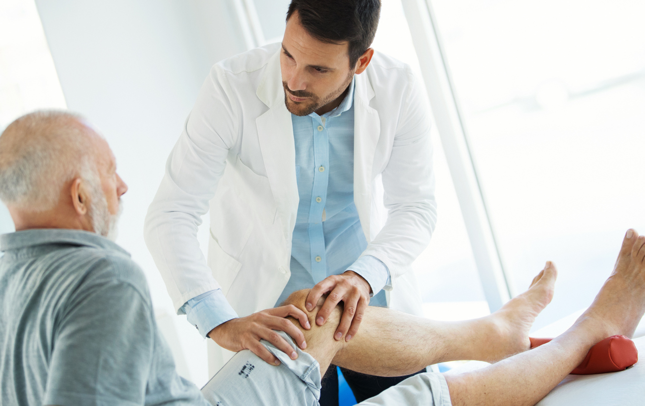 doctor checking patient for deep vein thrombosis