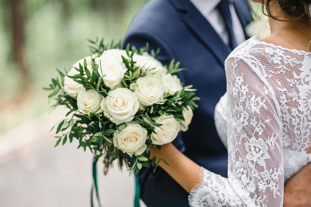 bride holds bouquet at wedding